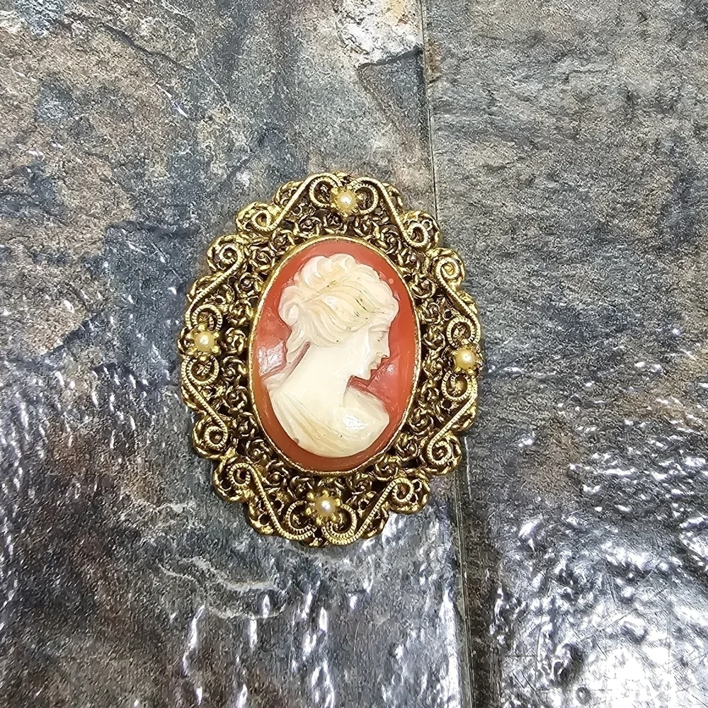 gold, orange, cream cameo brooch with pearls